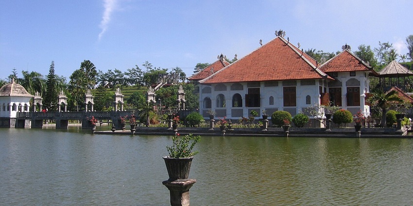 The Taman Ujung Water Palace seen on a beautiful sunny day showcasing blend of various architectural styles.