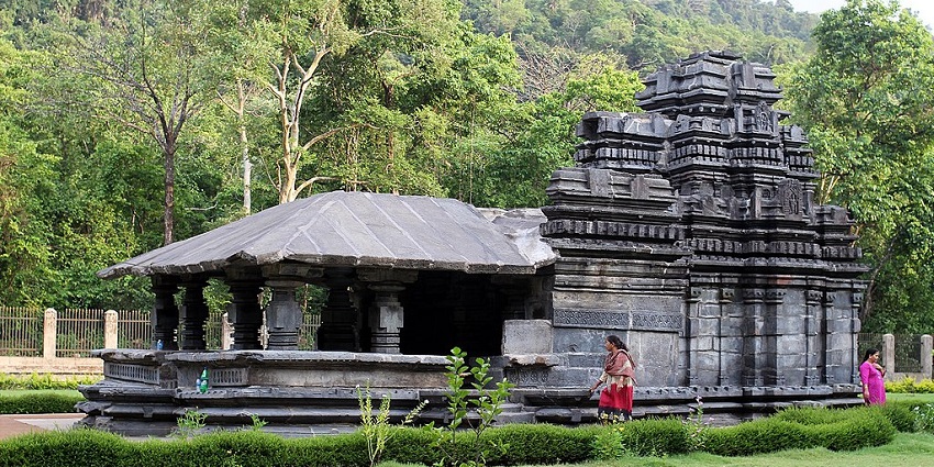 Marvel at the ancient Tambdi Surla Temple in Goa amidst verdant surroundings.