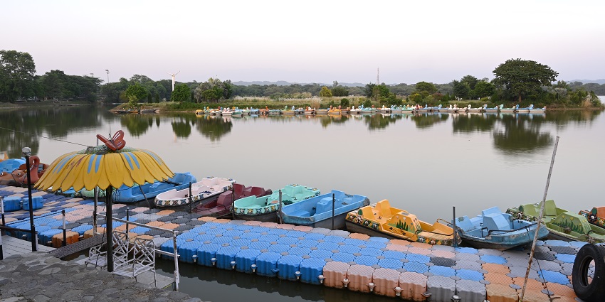An image of Tampara Lake, a lake in Odisha, with calm waters and lush greenery in Chatrapur.