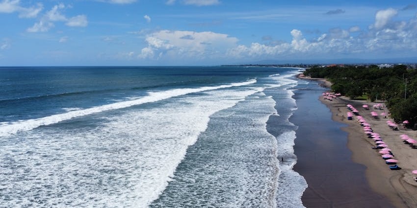 The waves at Tanjung Benoa, one of the beaches near Kuta, offers a sense of excitement