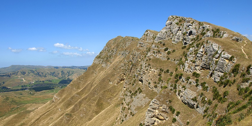 Te Mata peak, a rugged rocky cliffside with less vegetation one of the best places to visit in Napier.