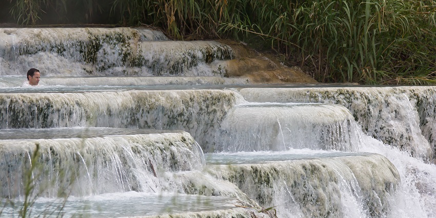 A mesmerising view of Saturnia Hot Springs amid the scenic Tuscan countryside.