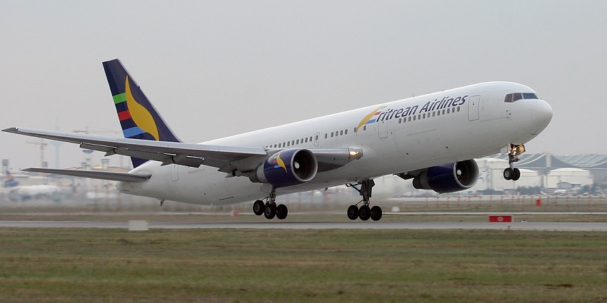 Eritrean Airlines aeroplane taking off from the runway with slightly elevated wheels
