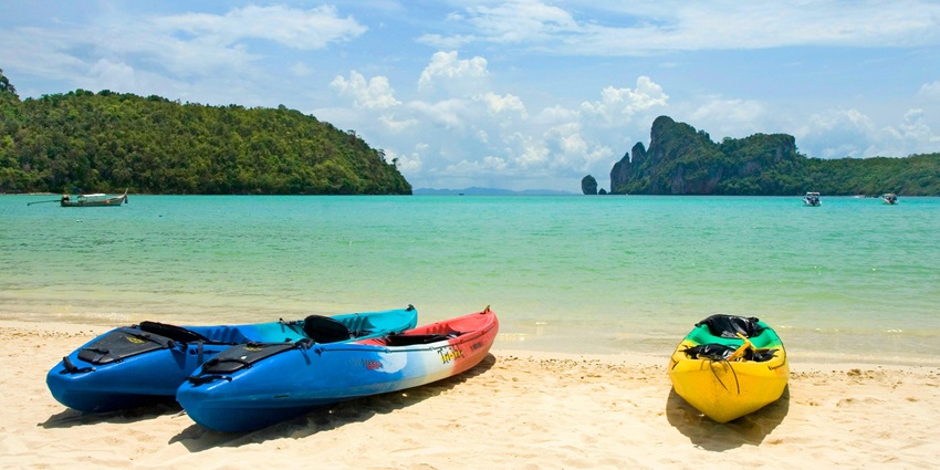 Sunset at a beach in Thailand, an ideal place in Asia for sea kayaking on this vacation.