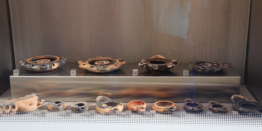 Archaeological finds and ancient ceramics on display at the Acropolis Museum in Greece.