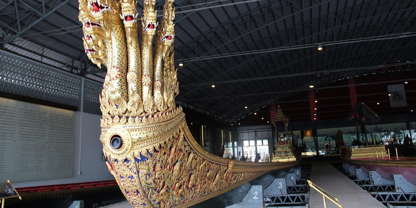 Beautifully designed royal barge featuring intricate carvings of mythical serpents.