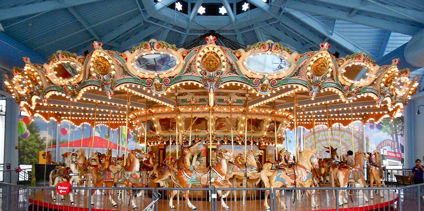 A view of The Carousel with colourful horses, an amazing place to visit in Geelong.