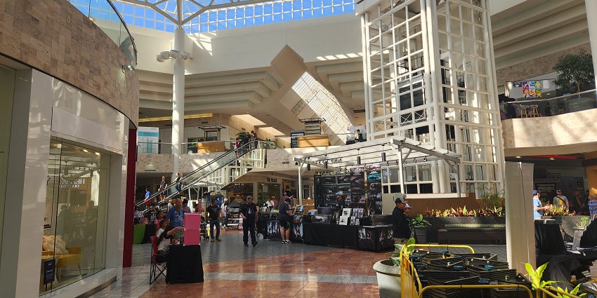 Stunning mall interior with elegant architecture, bustling with shoppers, and vibrant lighting