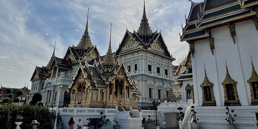 A majestic view of the Grand Palace, with its ornate architecture and golden spires.