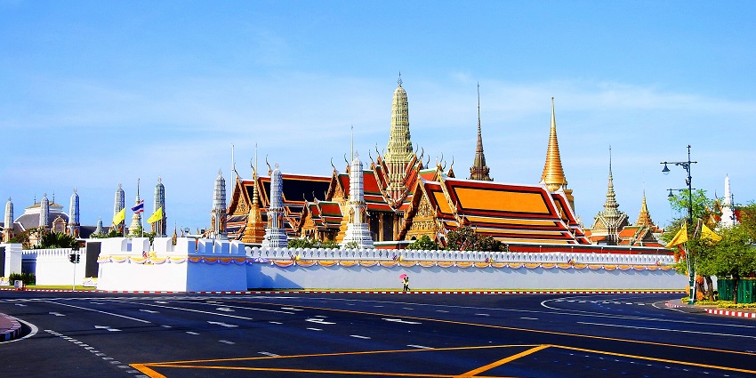 A photo of The Grand Palace in Bangkok, its beautiful golden spires and complex architecture on full display.