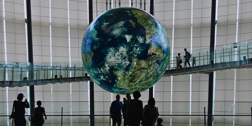 The Geo-Cosmos globe and interactive exhibits showcase quantum physics, nanotechnology, and space in science museums.