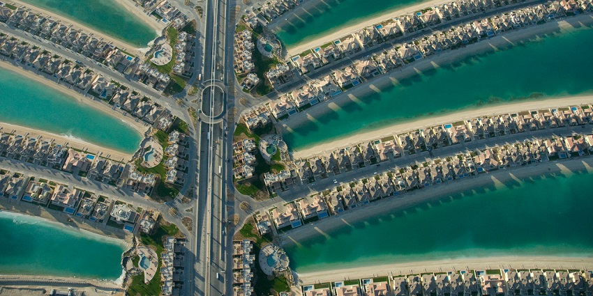Aerial view of Palm Jumeirah’s fronds in Dubai, a popular spot for parasailing adventures