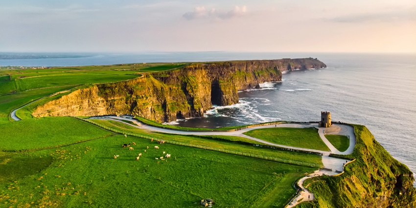 A dramatic coastal route featuring rugged cliffs, scenic beaches, and charming villages