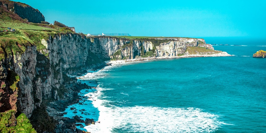 A dramatic coastal route featuring rugged cliffs, scenic beaches, and charming villages