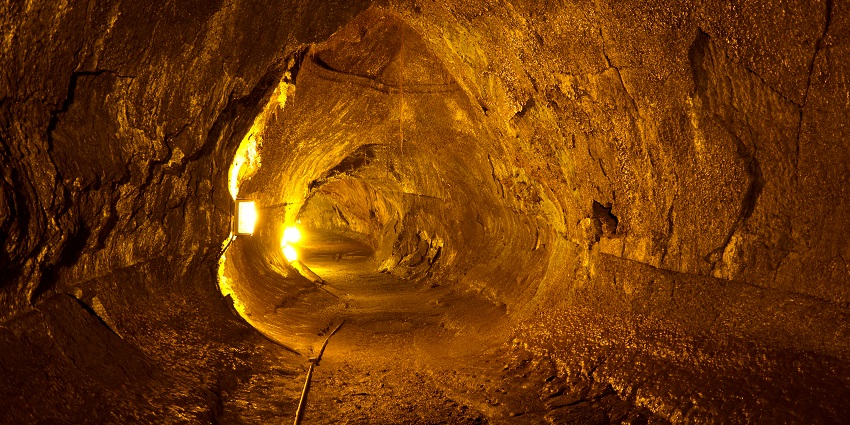 Viewing the cave's interior, offering an immersive experience through park's history
