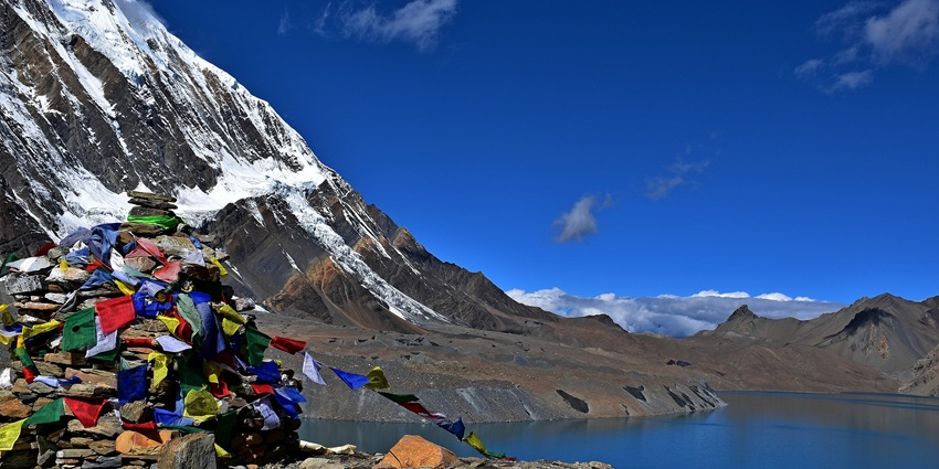 Tilicho Lake with deep blue waters and snowy peaks, one of the highest lakes in the world