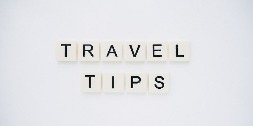 An image spelling 'TRAVEL TIPS' on background, suggesting helpful advice for travellers