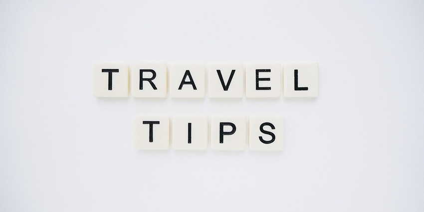 An image spelling 'TRAVEL TIPS' on background, suggesting helpful advice for travellers