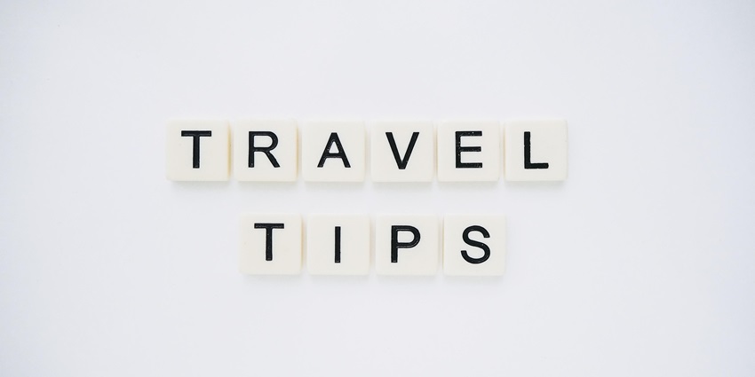 An image spelling 'TRAVEL TIPS' on background, suggesting helpful advice for travellers