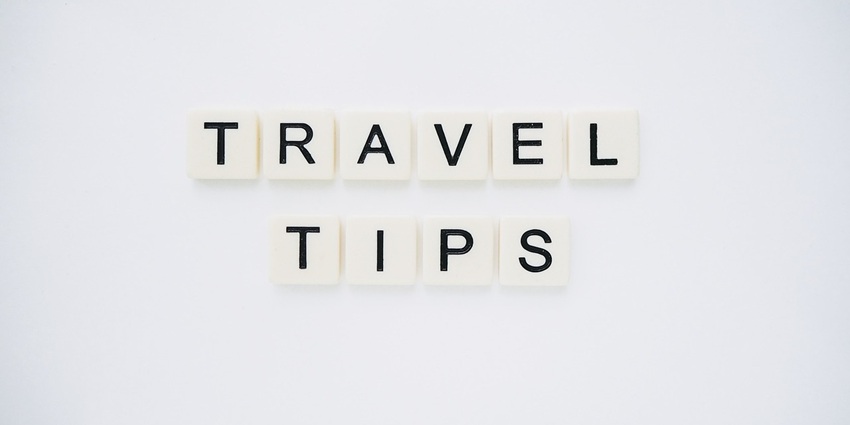 An image spelling 'TRAVEL TIPS' on background, suggesting helpful advice for travellers