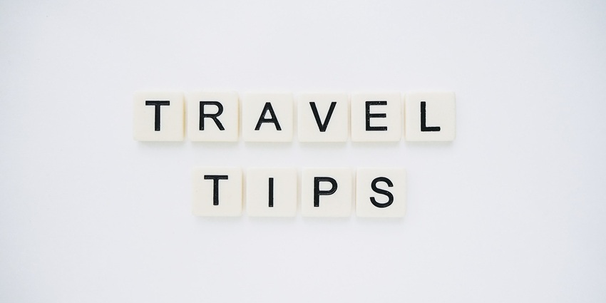 An image spelling 'TRAVEL TIPS' on background, suggesting helpful advice for travellers
