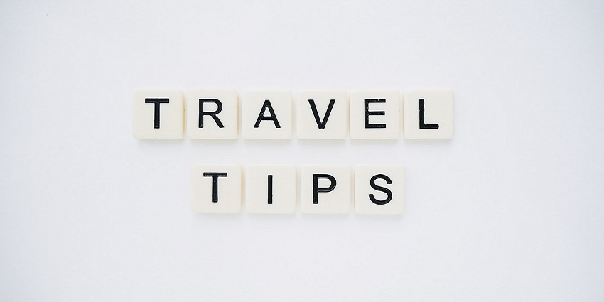 An image spelling 'TRAVEL TIPS' on background, suggesting helpful advice for travellers