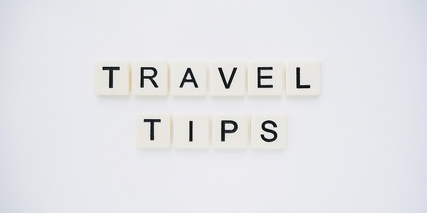 An image spelling 'TRAVEL TIPS' on background, suggesting helpful advice for travellers