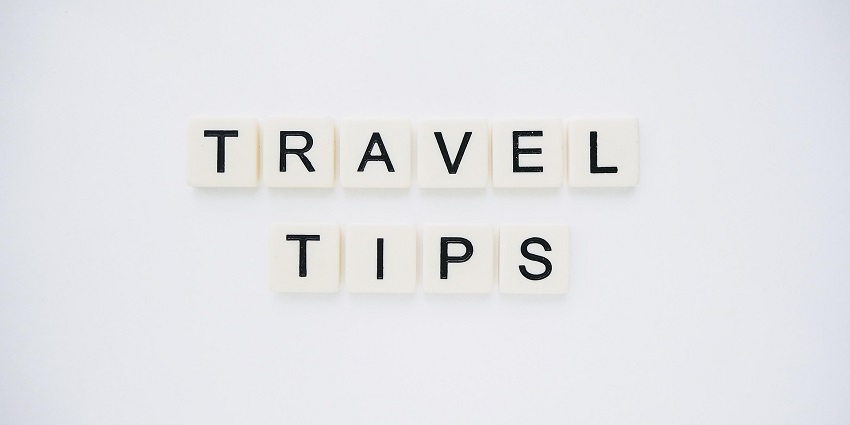 An image spelling 'TRAVEL TIPS' on background, suggesting helpful advice for travellers
