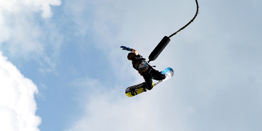 A glimpse of bunjee jumping in South Goa, with a person jumping attached with a rope.