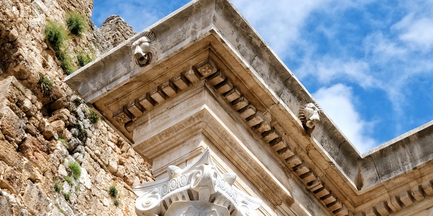 An information board near Hadrian's Gate, providing historical details.