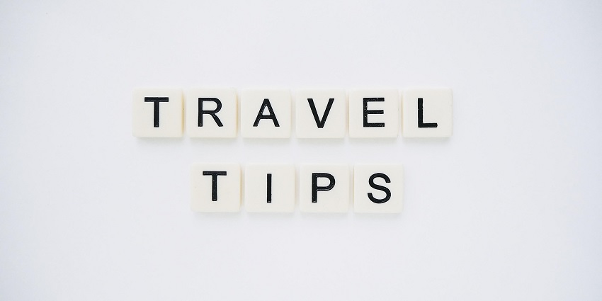 An image spelling 'TRAVEL TIPS' on background, suggesting helpful advice for travellers