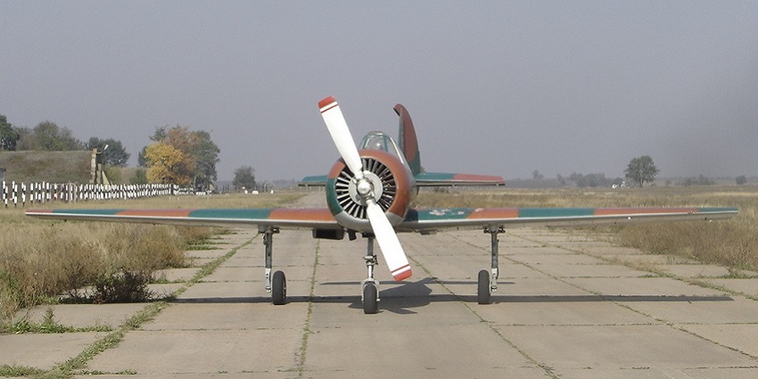 A single engine aircraft is parked at the runway of Tiraspol Airport in Moldova.