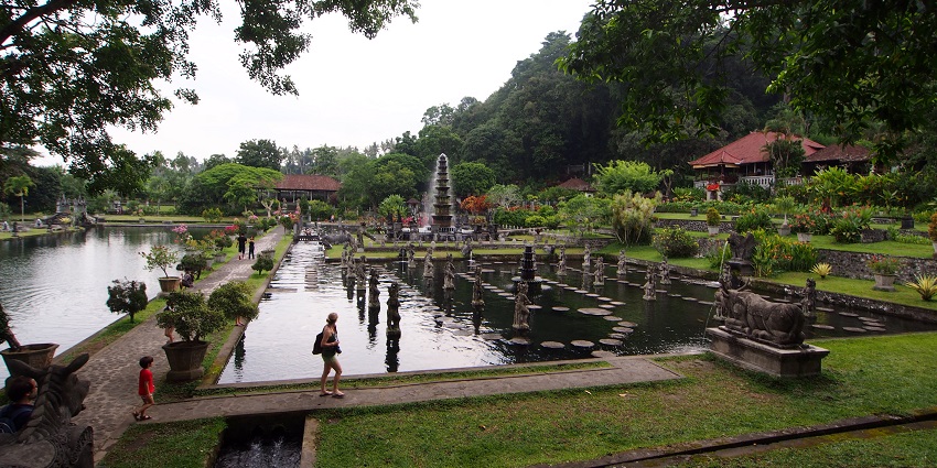 Beautiful view of Tirta Gangga Water Palace, featuring its intricate fountains and lush greenery.