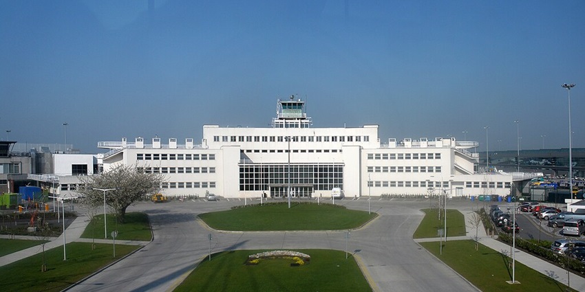 A white-coloured airport with a huge background that comprises smooth buttery runways.
