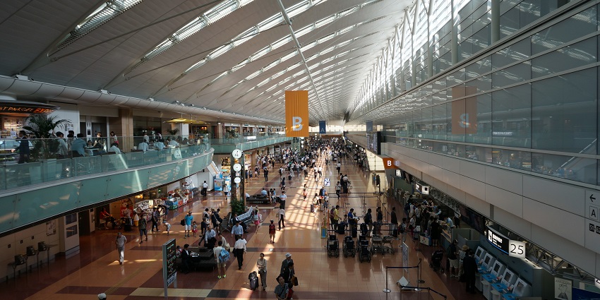 A passenger traffic scene at Tokyo Haneda Airport, one of the best airports in the world.