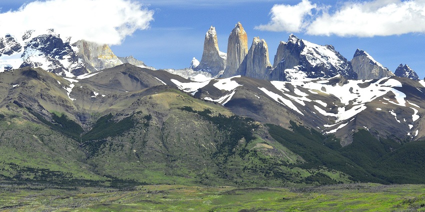 Torres del Paine and Laguna Azul, highlighting the mountainous terrain and waterbody.