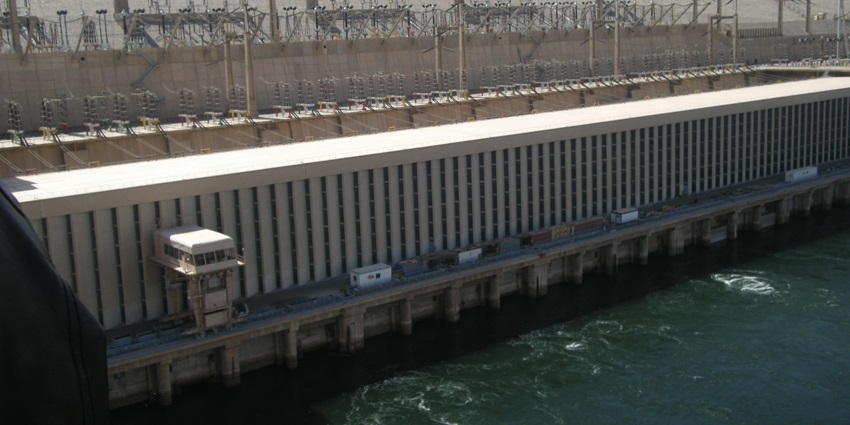 An image of the Aswan High Dam in Egypt, showcasing its massive structure and the Nile River.