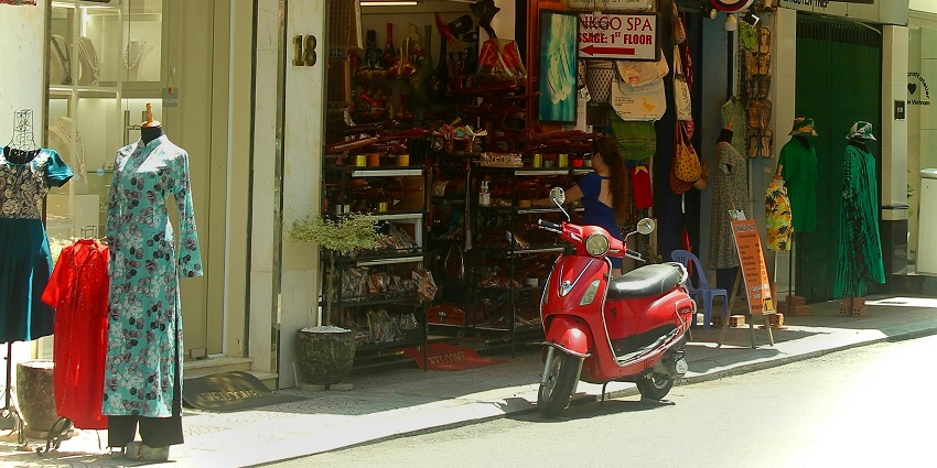 Browse through handmade clothes at the Hoi An night market for unique souvenirs.
