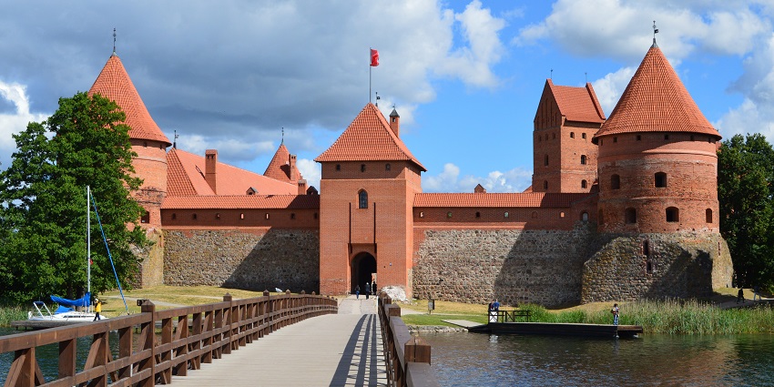 Trakai Island Castle is surrounded by calm lake water, reflecting its medieval architecture
