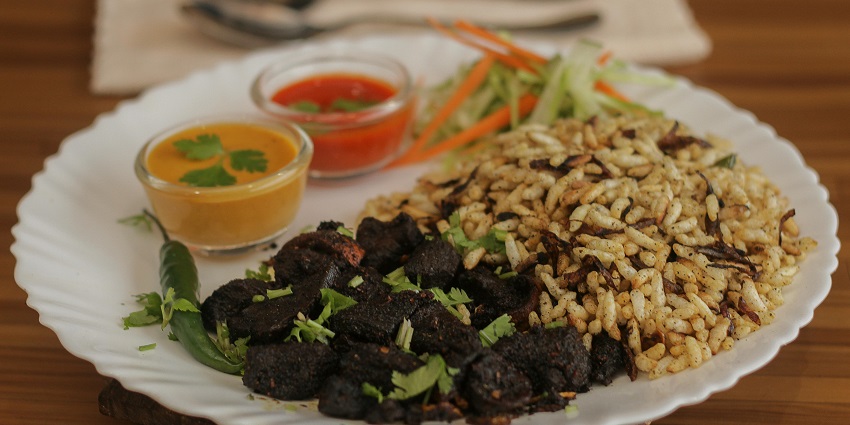 A traditional Bhutanese meal of rice with Ema Datshi, enjoyed in Bumthang Bhutan