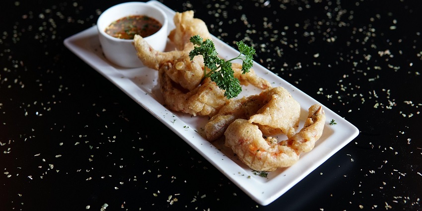 An image of delicious seafood meal on a white plate, one of the things to try in tangalle
