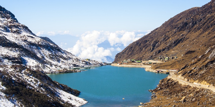 Tsongmo Lake has clear water and is surrounded by rugged and snow-capped mountains
