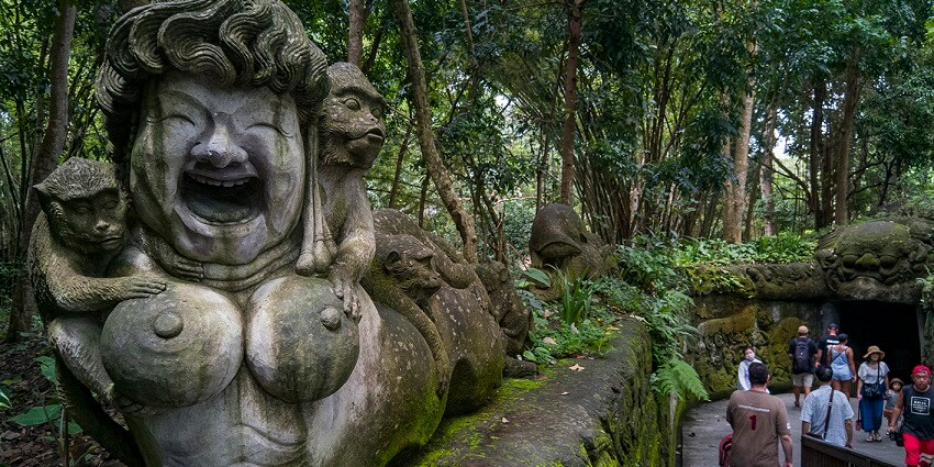 Wander through a sacred jungle sanctuary home to playful monkeys in Ubud.
