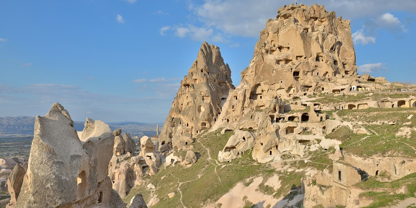 A picture of Uchisar Castle, perched on a rocky hill with panoramic views.