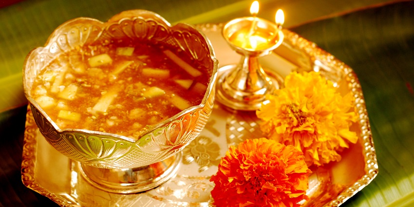 An image of homes decorated with mango leaves and families preparing Bevu-Bella for Ugadi