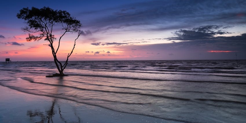 Picturesque view of the Upali Beach, adorned by the pink sunset hues.
