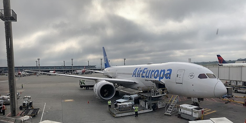 An AirEuropa aircraft is getting ready to take off near the runway at an airport.