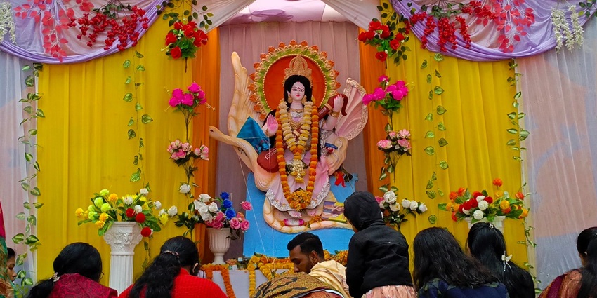 Goddess Saraswati dressed in a yellow sari for the Vasant Panchami Festival.