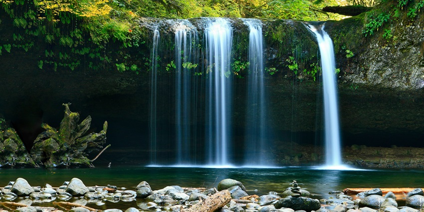 A serene view of Veal Pouch Waterfall, one of the top places to visit in Kampot.