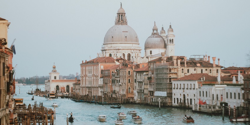 Cruise Venice’s canals on a gondola and admire its enchanting historic architecture.